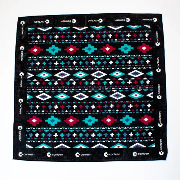 A wide shot photo of the Aztec bandana laid out flat