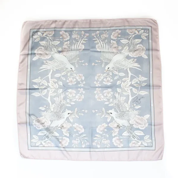 A wide shot photo of the Premium Birds bandana laid out flat