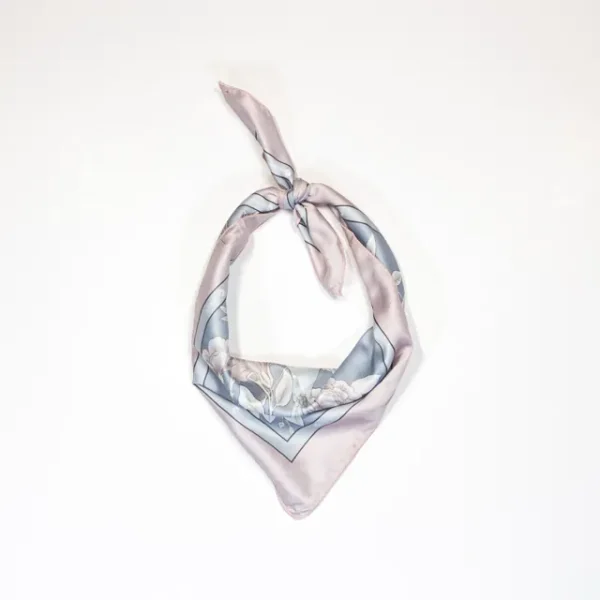 A photo of the Premium Birds bandana tied up and styled