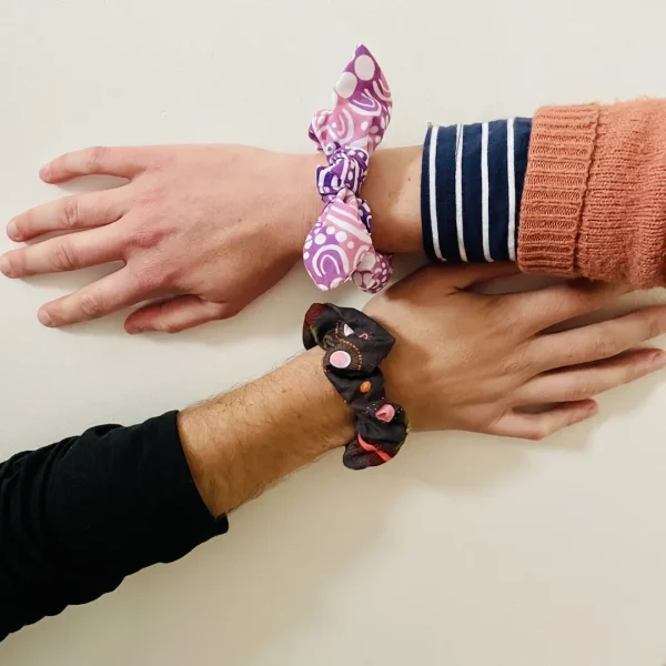 two people wearing a Aussie Flora x Matriarch scrunchie set on their wrist