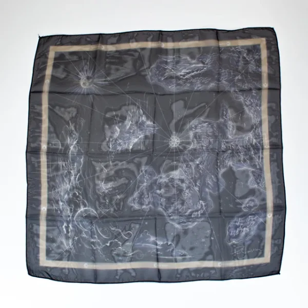 A wide shot photo of the East of the Sun, West of the Moon premium bandana laid out flat