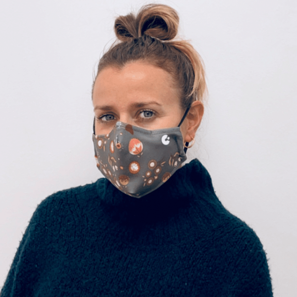 A person wearing an Aussie flora face mask